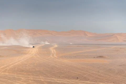 Rolling sand dunes, striped lines, beautiful silhouettes, in the Kumtag des.. Stock Photos