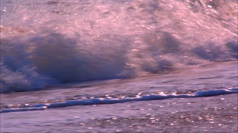 Rolling sea shot in slow motion at sunset Stock Footage 51166640