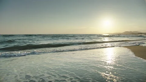 Rolling sea waves washing empty beach Stock Footage 155898715