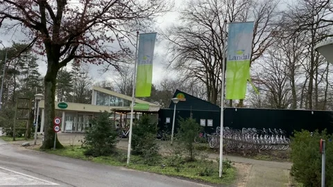 A rolling shot of 2 flags from Landal GreenParks. Stock Footage 148688895