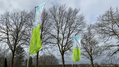 A rolling shot of 2 flags from Landal GreenParks. Stock Footage 148688912