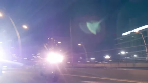 Rolling shot of two men bikers riding motorcycles in the city street at night Stock Footage 214081678