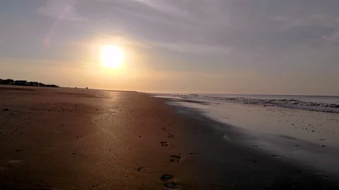 Rolling shot of waves coming in on the beach at Charleston S.C. Stock Footage 97962675