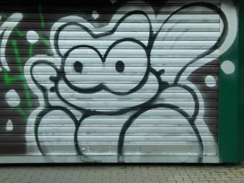 Rolling shutter with graffiti cat Foto stock