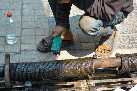Rolling shutter spring unit repair and cleaning &amp; brushing Stock Photos