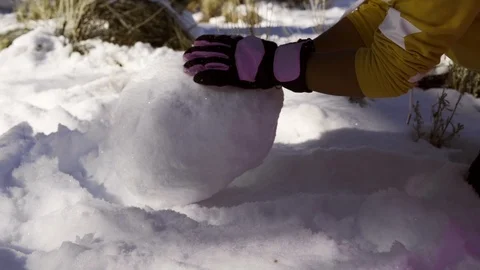 Rolling the snowball Stock Footage 100889444