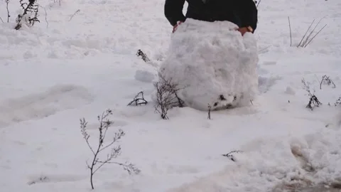 Rolling a snowball Stock Footage 170346312