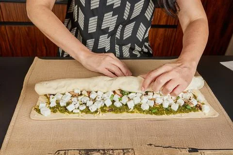 Rolling stuffed flatbread for baking Stock Photos