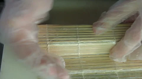 Rolling up the sushi roll with bamboo mat, upside view 스톡 동영상 41949111