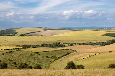 A rolling Sussex landscape with patchwork fields on a sunny day Stock Photos