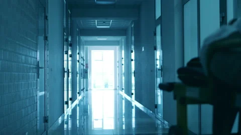 Rolling table with a patient is getting relocated by a paramedic 스톡 동영상 130878304