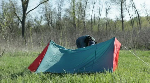 Rolling up a tent Stock Footage