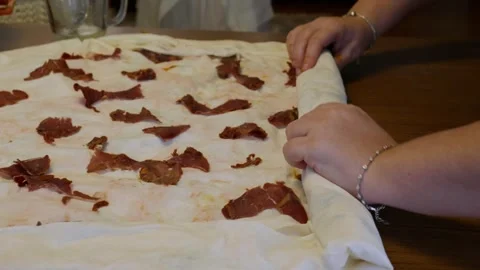Rolling Thin Dough Filled with Pastirma Slices for Savory Pastry Video stock 330591853