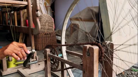 Rolling thread into a spool the old way Stock Footage 308797677