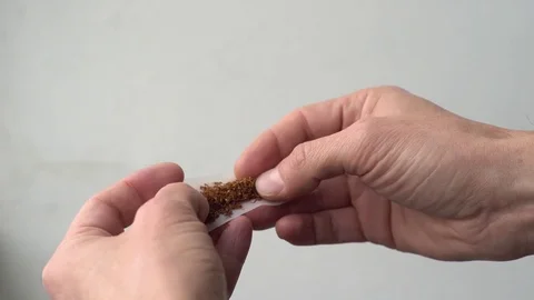 Rolling tobacco cigarette Stock Footage 70304586