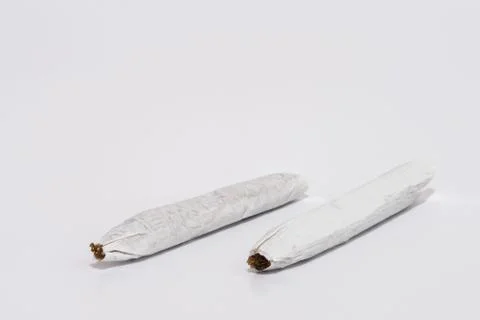 Rolling tobacco two sigarettes Stock Photos