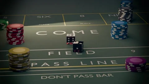 Rolling two black dice from toss, bouncing, turning, stopping on craps table Stock Footage 340268353