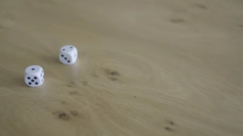 Rolling two dice on a table. Stock Footage 128296939