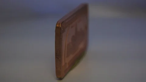 A Rolling Vintage Golden Brown Rectangular One Hundred Dollar Coin 스톡 동영상 129482818