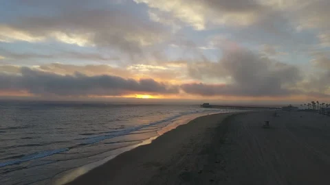 Rolling waves along the coast at sunset Stock Footage 157140458