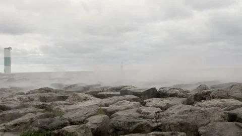 Rolling waves along shore of Lake Michigan. Harbor markers present. Stock Footage 164347655