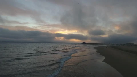 Rolling waves along the shore at sunset Stock Footage 157140543