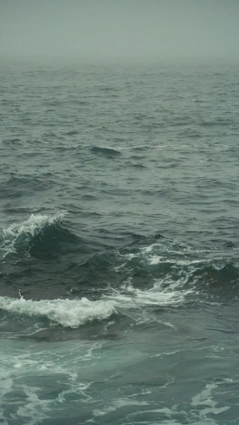 Rolling Waves and Misty Horizon on a Gloomy Sea, vertical shot Vidéo 284929403