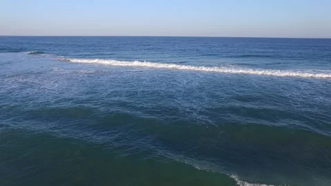 Rolling waves and setting sun Video stock 134006225