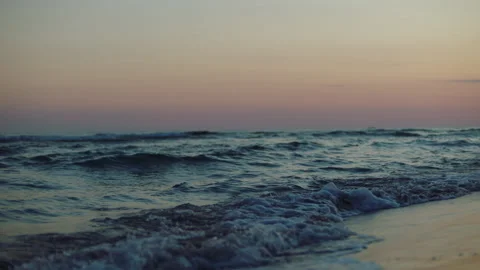 Rolling waves on beach after sunset Stock Footage 155912632