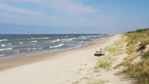 Rolling waves on the beach with blue sky Stock Footage 116493164
