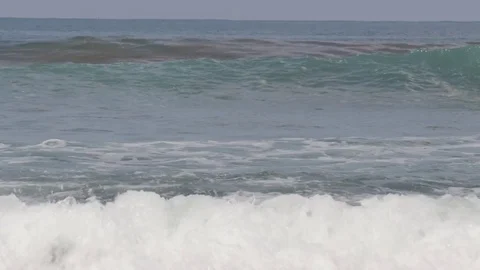 Rolling waves on beach in Pangandaran Java Indonesia Stock Footage 84046057