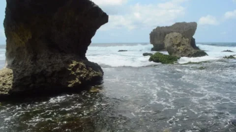 Rolling waves crashing against the rocks Stock Footage 292319434