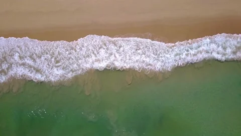 Rolling Waves Crashing on Smooth White Sand Beach Top Down Drone Aerial View Stock Footage 200331956