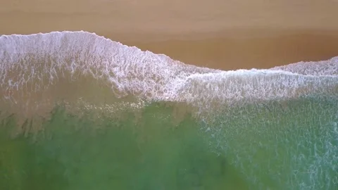 Rolling Waves Crashing on Smooth White Sand Beach Top Down Drone Aerial View Stock Footage 200339655