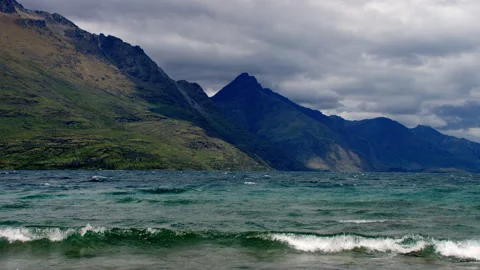 Rolling waves on lake edge with storm approaching Stock Footage 159749427