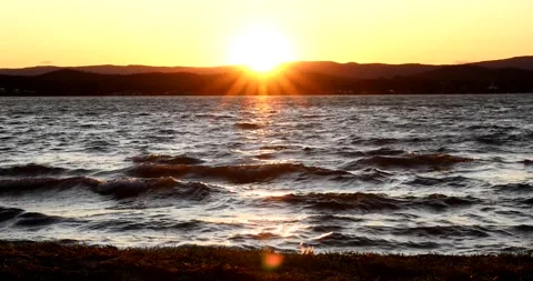 Rolling waves on the lake at Sunset Stock Footage 211066395