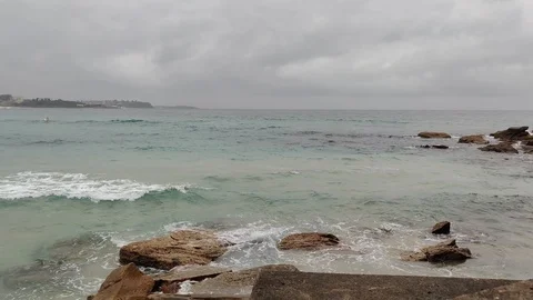 Rolling waves in water of cloudy beach ocean, 4K Stock Footage 122311818