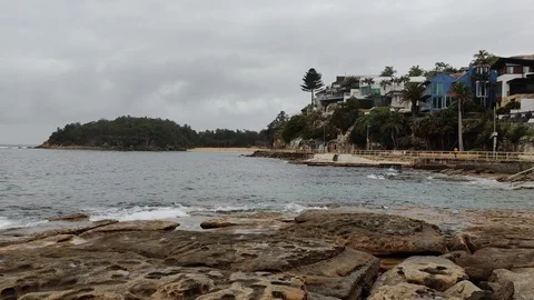 Rolling waves in water of cloudy beach ocean Stock Footage 122321460