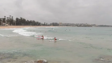 Rolling waves in water of cloudy beach ocean Stock Footage 122322161