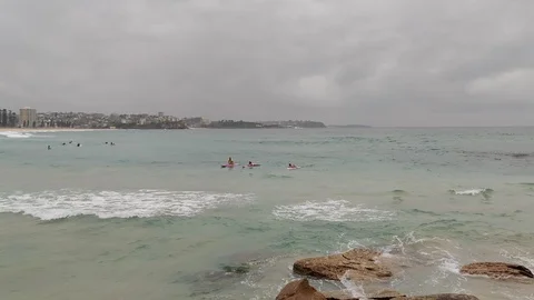 Rolling waves in water of cloudy beach ocean Stock Footage 122322785