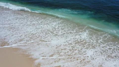 Rolling waves on a white sand beach Stock Footage 155177683