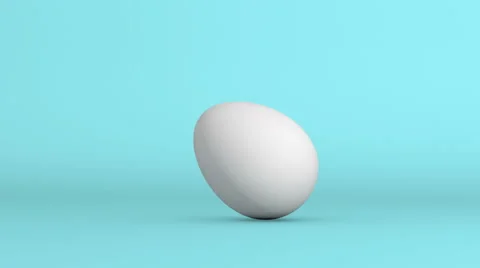 Rolling White Egg on blue screen. with alpha matte Stock Footage 50324480
