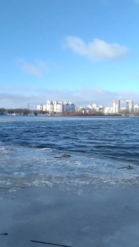 Rolling Winter Waves Along an Urban Frozen Lake Stock Footage 306070693