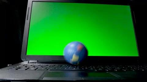 Rolling a world stress ball on a keyboard Stock Footage 149371893