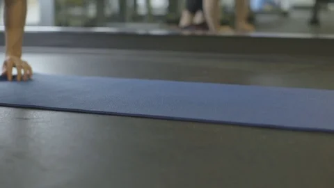 Rolling Up Yoga Mat Inside Gym Stock Footage 78041901