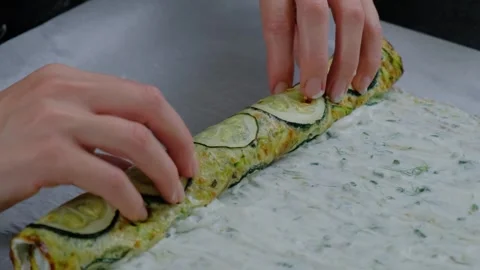 Rolling Zucchini Rolls with Creamy Spread Cooking Stock-Footage 341435177