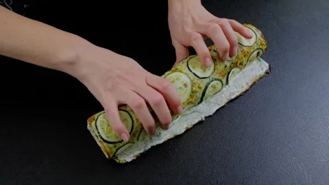 Rolling Zucchini Slices on Bread Hands Cooking Stock Footage 341436896