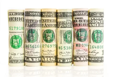 Rolls of american dollar banknotes in one row Stock Photos