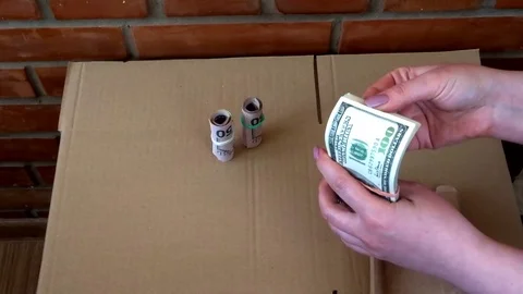 Rolls and a pack of 50 dollar bills Video stock 94450039