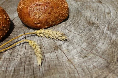 Rolls and wheat Stock Photos
